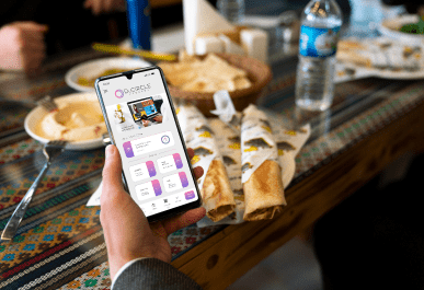 a person holds a mobile and opens duCirlce app